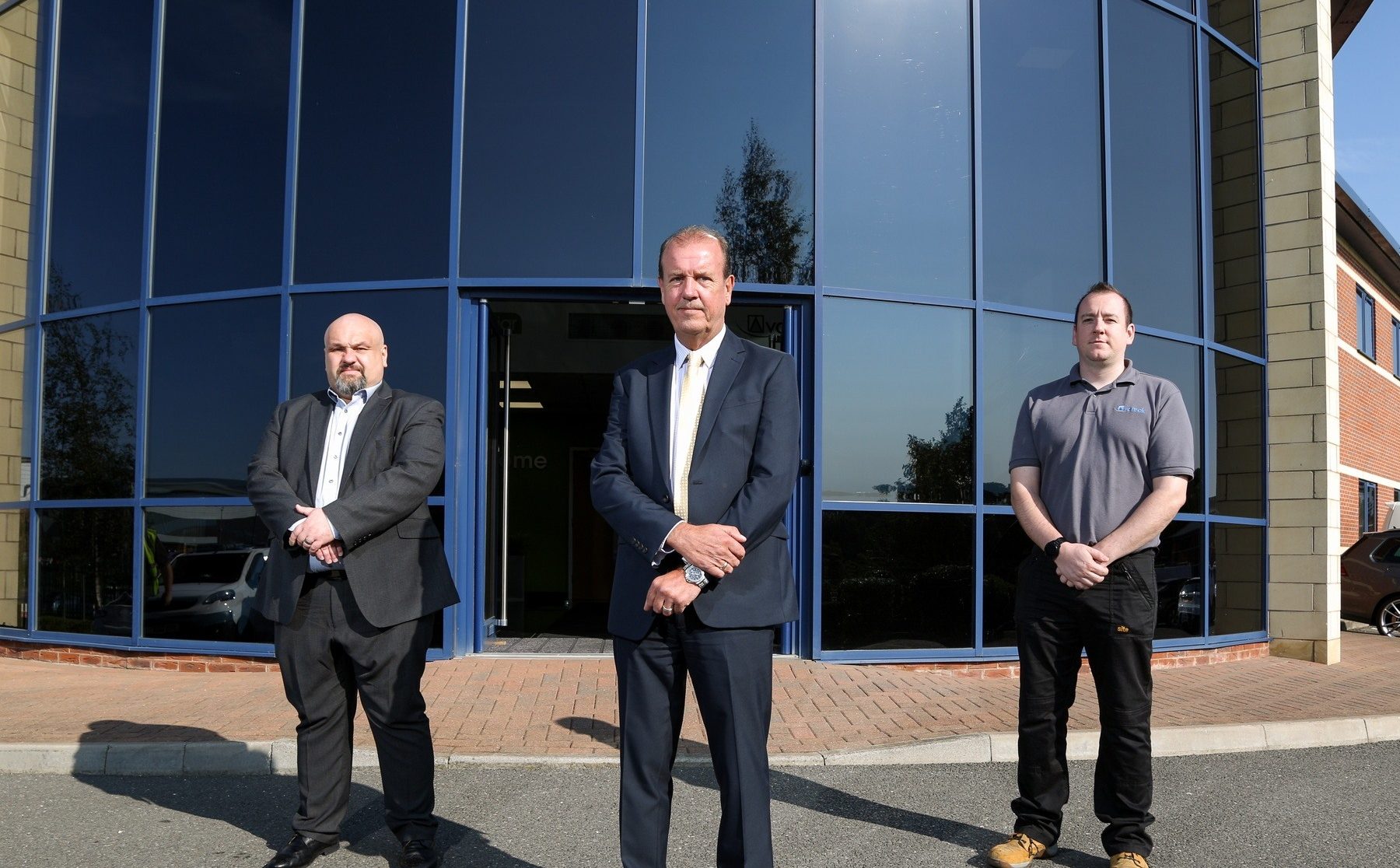 Andy Weir, Michal Poletko and Jamie Munday in front of Avantek HQ